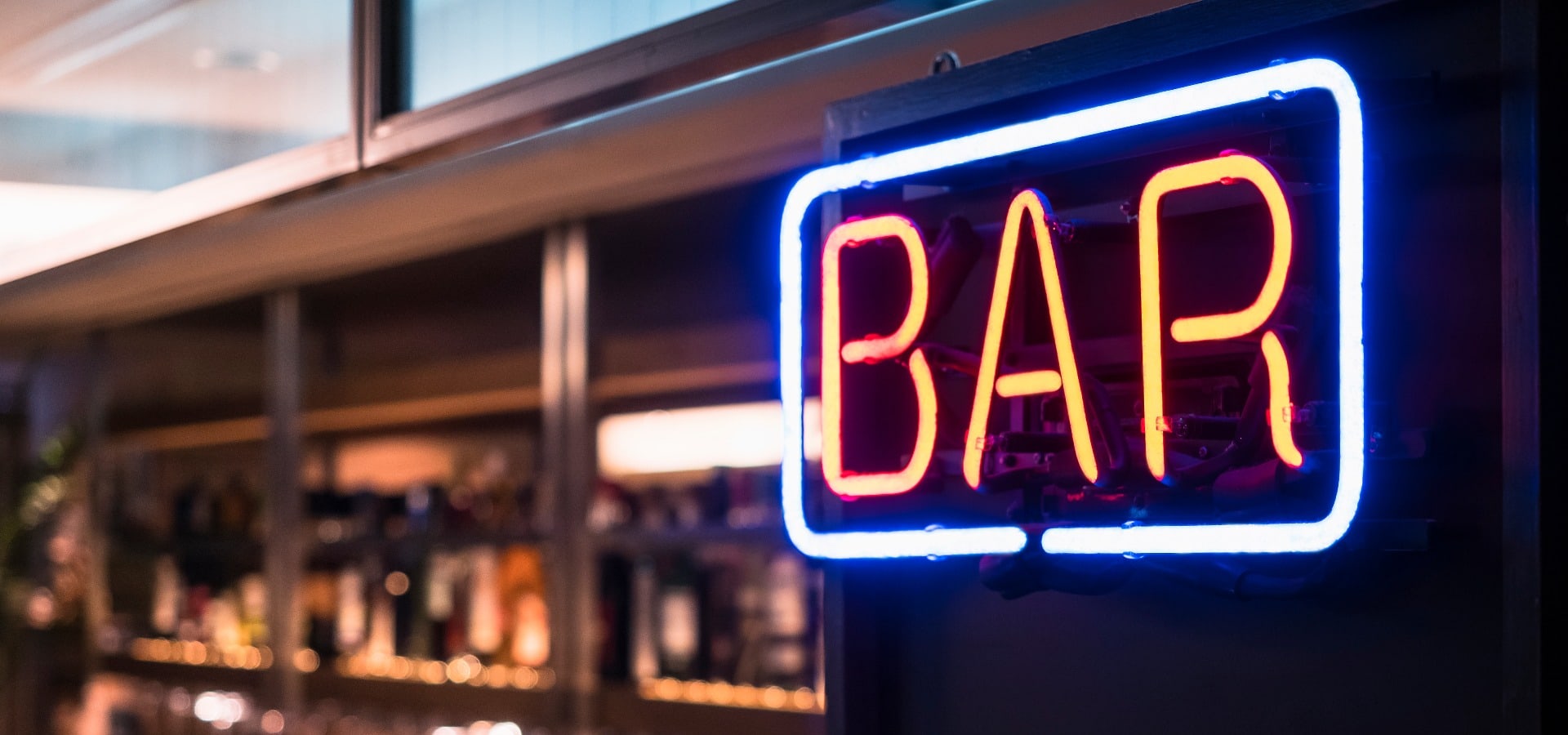 Bar Neon sign with Blur counter bar background